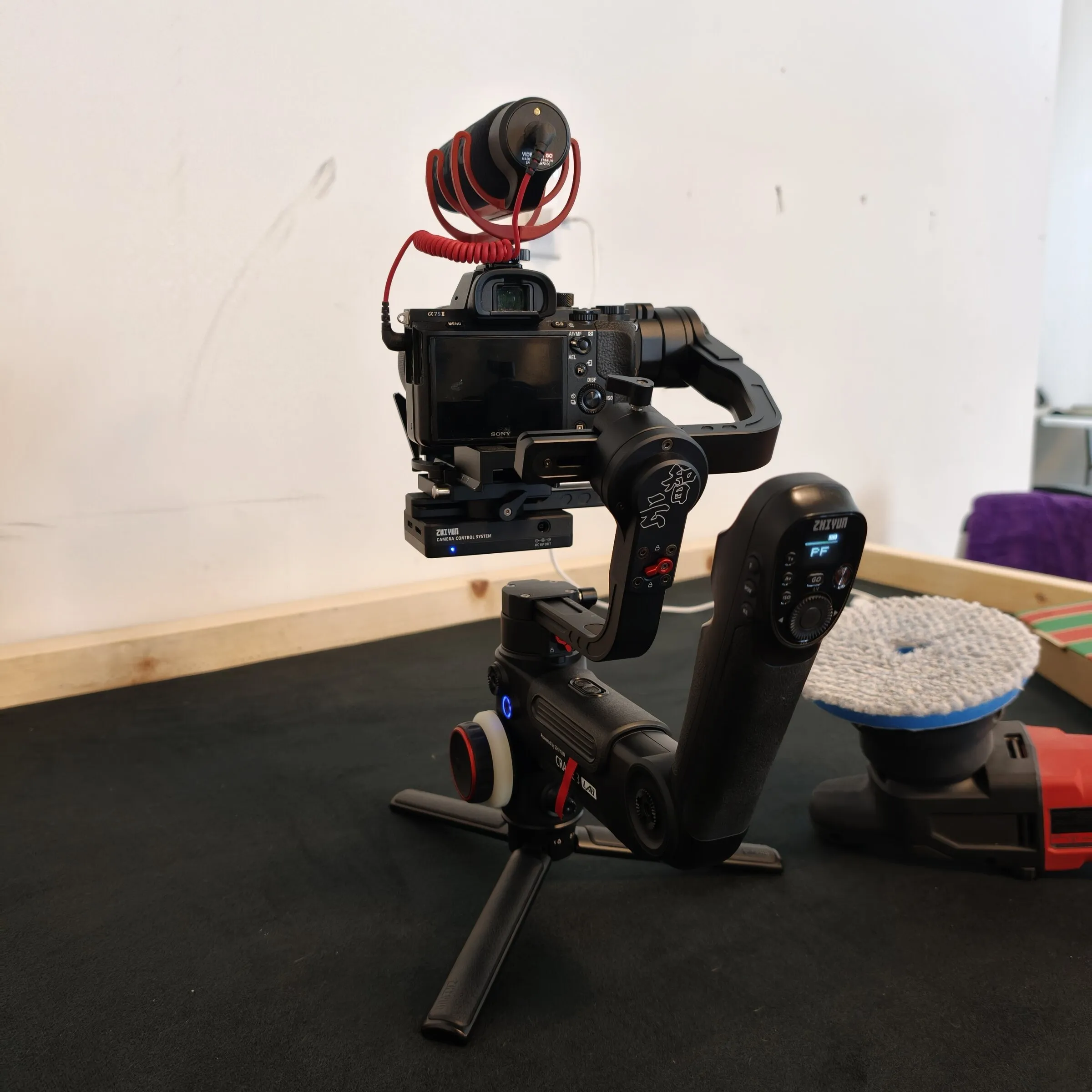Camera with a shotgun mic balanced on a gimbal